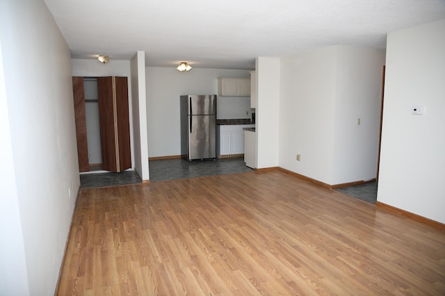 unfurnished living room featuring wood-type flooring