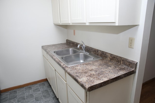 kitchen with white cabinets and sink