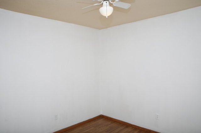 unfurnished room with hardwood / wood-style floors and ceiling fan