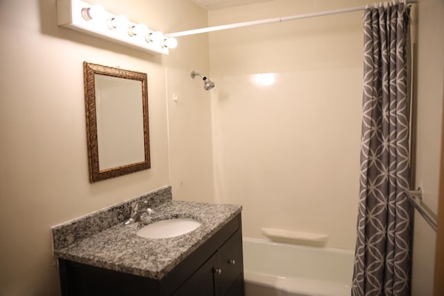 bathroom featuring vanity and shower / bathtub combination with curtain