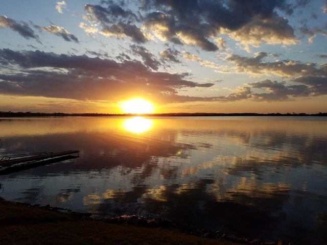 property view of water with a dock