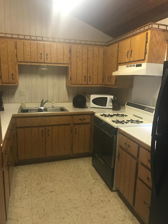 kitchen featuring sink and white appliances