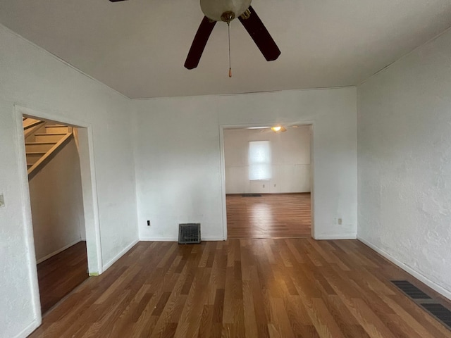 spare room featuring ceiling fan and wood-type flooring