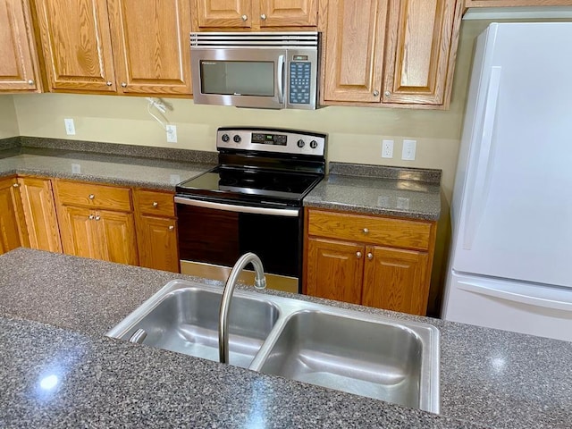 kitchen featuring stainless steel appliances and sink