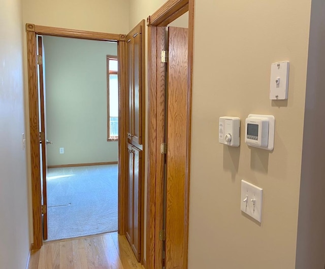 hallway featuring light hardwood / wood-style flooring