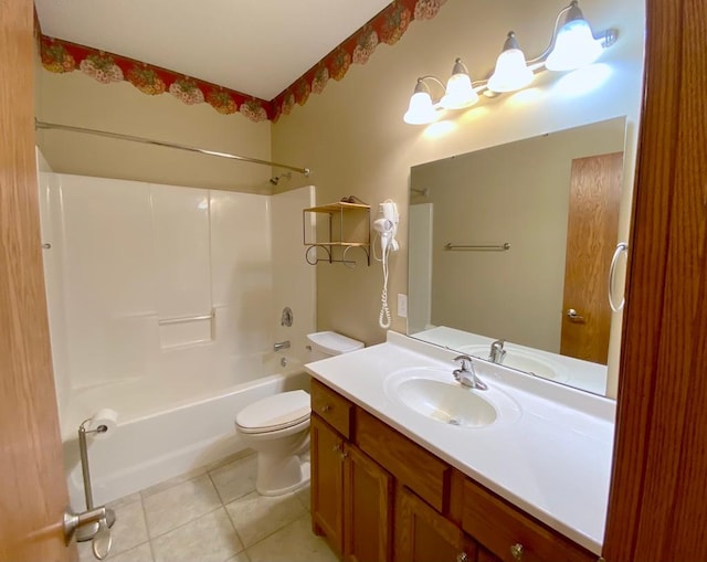 full bathroom featuring toilet, vanity, tub / shower combination, and tile patterned flooring