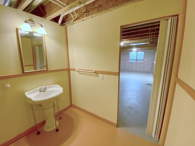 bathroom featuring concrete flooring and sink