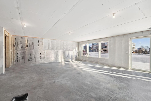 spare room featuring concrete flooring