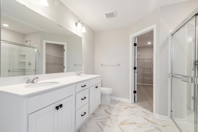 bathroom with vanity, toilet, and walk in shower