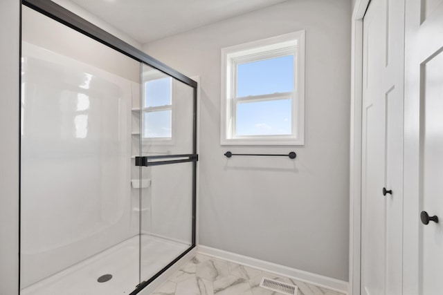 bathroom featuring an enclosed shower