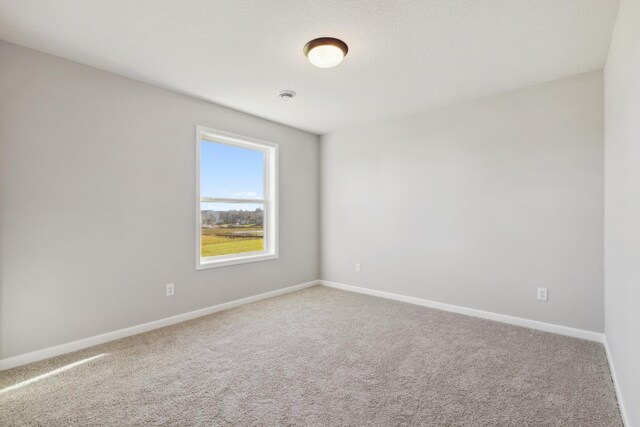 empty room with carpet flooring