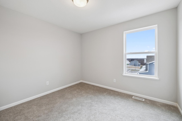 empty room featuring carpet floors