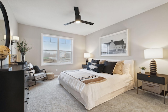 bedroom with ceiling fan and light colored carpet