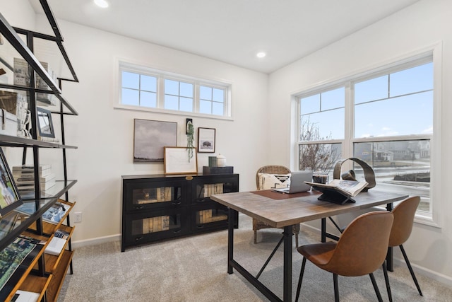 office area featuring recessed lighting, light colored carpet, a healthy amount of sunlight, and baseboards