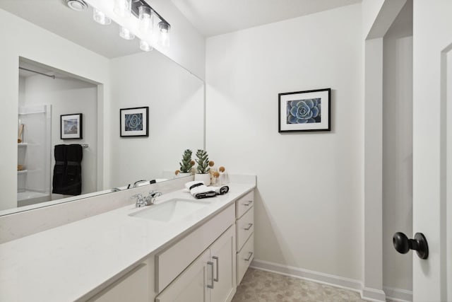 bathroom featuring vanity and baseboards