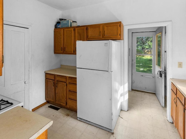 kitchen featuring white fridge