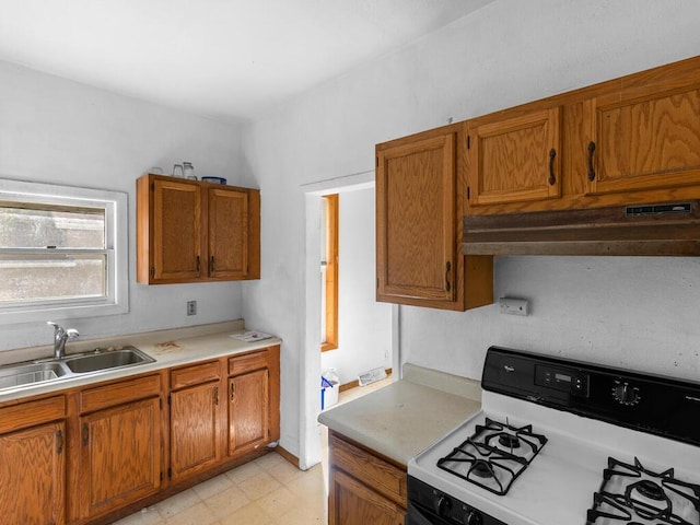 kitchen with sink and gas range gas stove