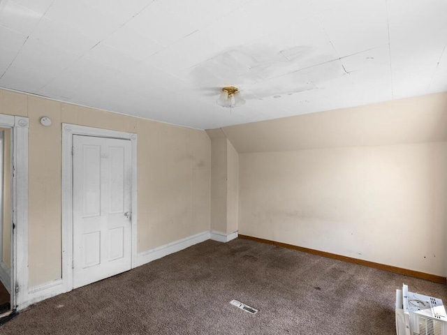 bonus room with carpet and vaulted ceiling