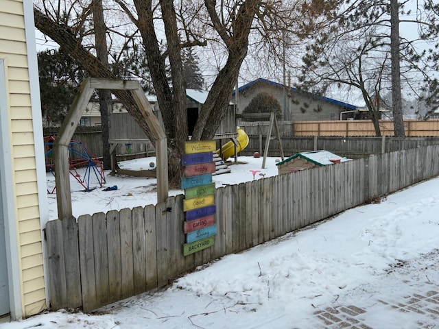 view of yard layered in snow