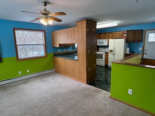 kitchen with dark colored carpet, white appliances, ceiling fan, and a baseboard heating unit