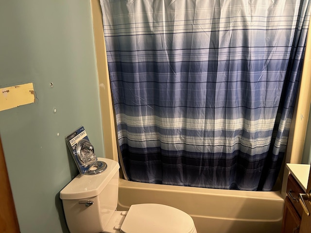 full bathroom with vanity, shower / bath combination with curtain, and toilet