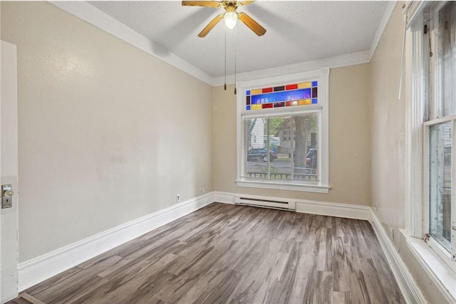 unfurnished room featuring ceiling fan, crown molding, wood-type flooring, and a textured ceiling