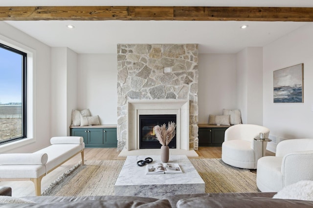 living room featuring light hardwood / wood-style floors and a fireplace