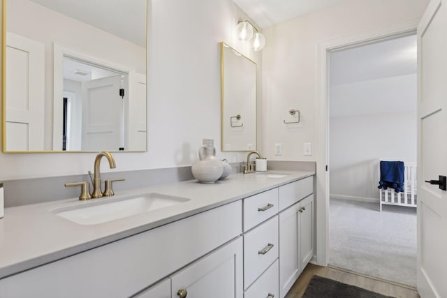 bathroom with hardwood / wood-style flooring and vanity