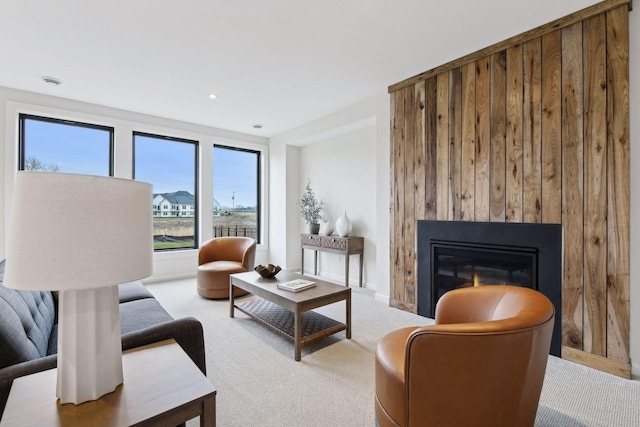 carpeted living room with a fireplace