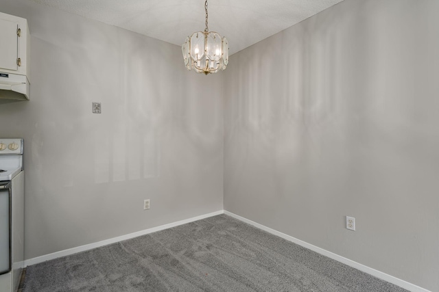 unfurnished dining area with carpet and a chandelier