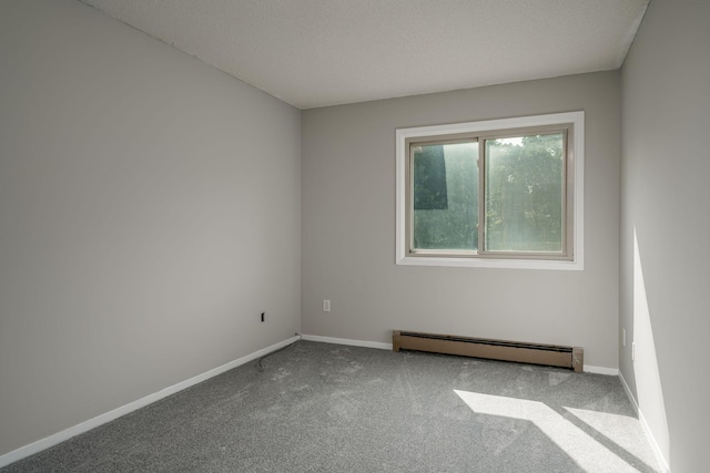 unfurnished room with baseboard heating and carpet floors