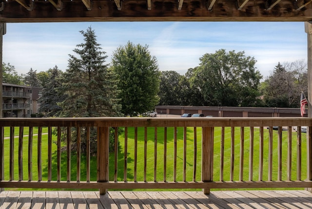 wooden terrace with a yard