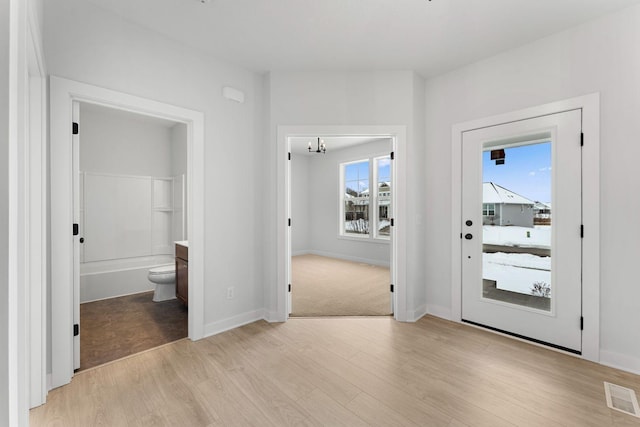 foyer with light wood-type flooring