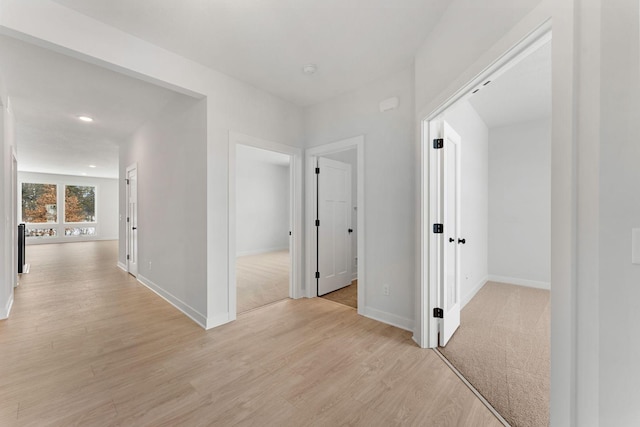 hallway featuring light wood-type flooring