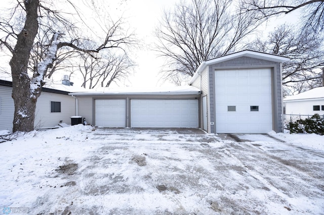 view of snow covered garage