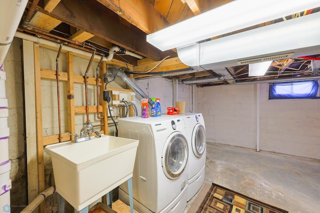 laundry area featuring sink and washing machine and dryer