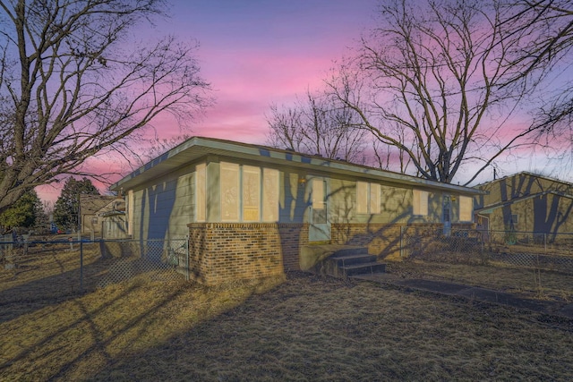 view of property exterior at dusk