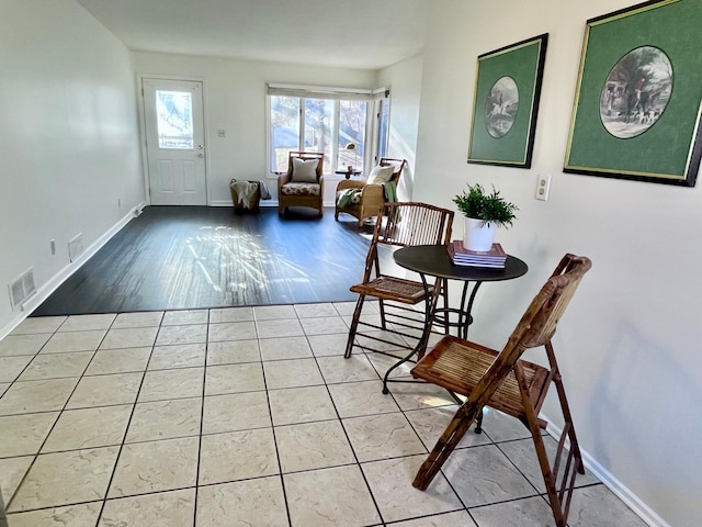 sitting room featuring tile patterned flooring