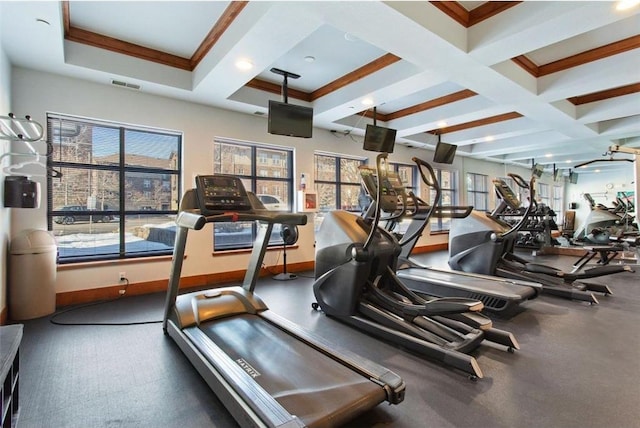 workout area with crown molding and coffered ceiling