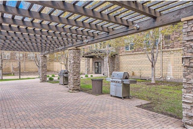 view of patio with a pergola and a grill