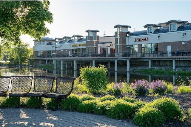 surrounding community featuring a water view