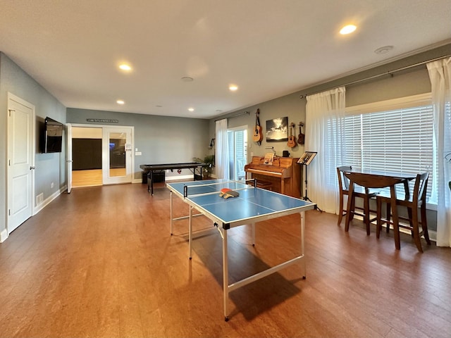 rec room with dark hardwood / wood-style flooring