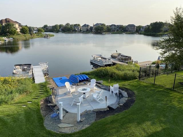 exterior space featuring a boat dock and fence