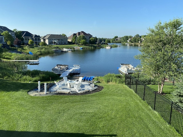 property view of water featuring fence