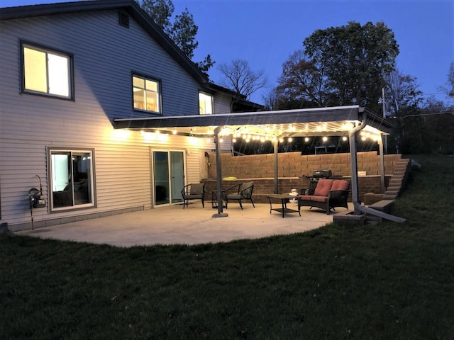 back of property featuring a pergola, an outdoor hangout area, a patio area, and a lawn