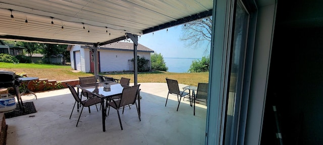 view of patio with an outbuilding