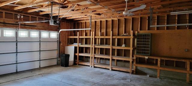 garage with ceiling fan and a garage door opener