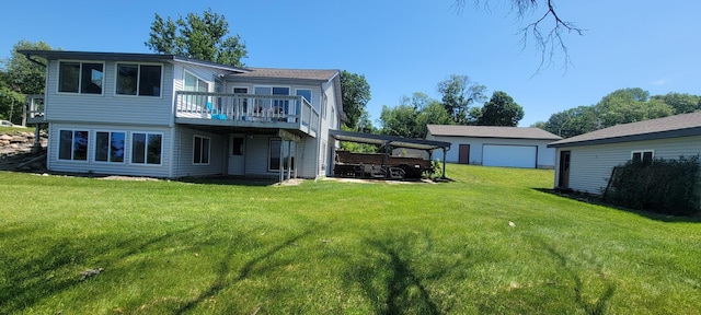 back of house featuring a wooden deck and a yard