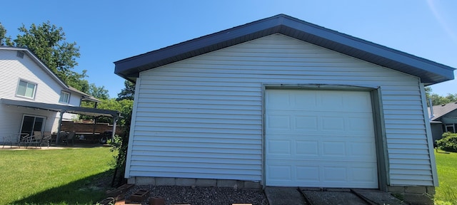 garage featuring a lawn