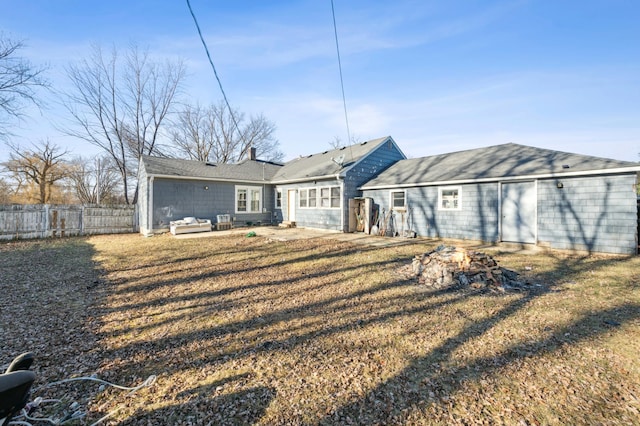 rear view of house featuring an outdoor hangout area and a lawn